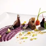 Stanna på en eller två Michelin-stjärniga restauranger.